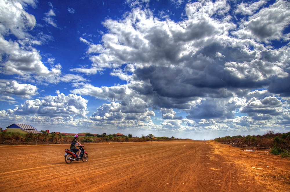 Riding a moto on the abandoned Ratanakiri airstrip