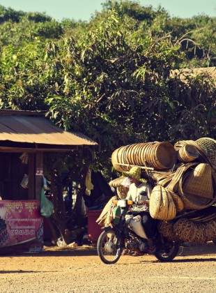 Basket Seller in Lompat, Cambodia on a Honda super cub