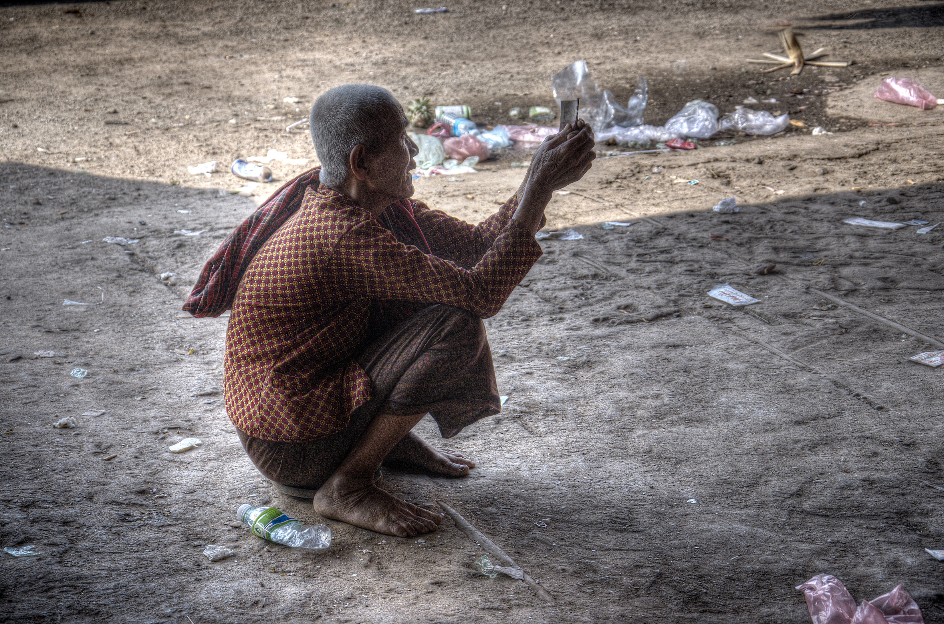 An old widow begging for food and money in Kampong Cham Province, Cambodia