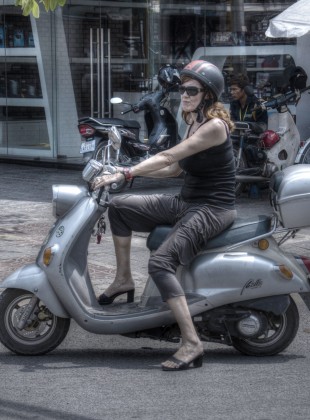 An expat in Phnom Penh, Cambodia, riding a German Zundapp Bella scooter.