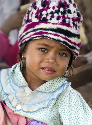 Tampuan girl with striking, light-colored eyes